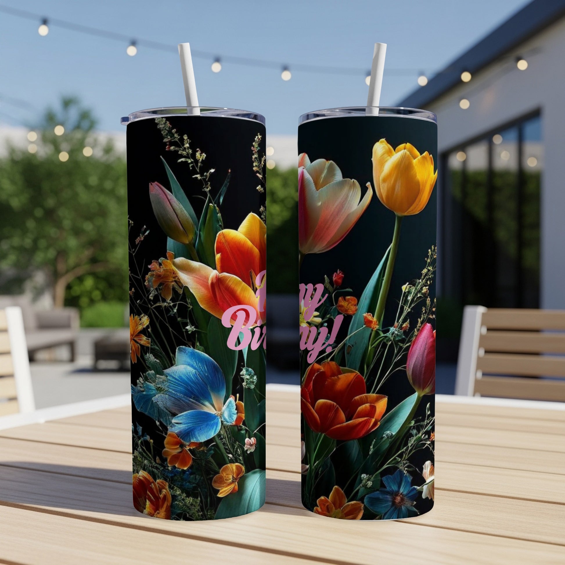 Two tumblers with a vibrant floral design featuring butterflies and text.
