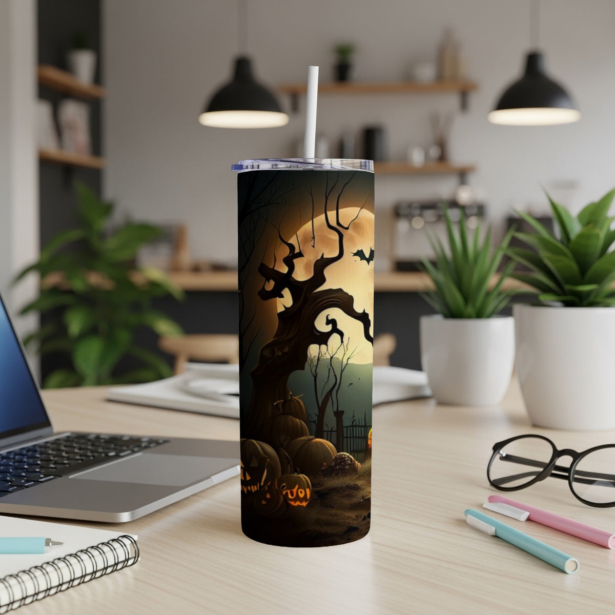 Halloween tumbler with spooky tree, pumpkins, bats, and full moon design.