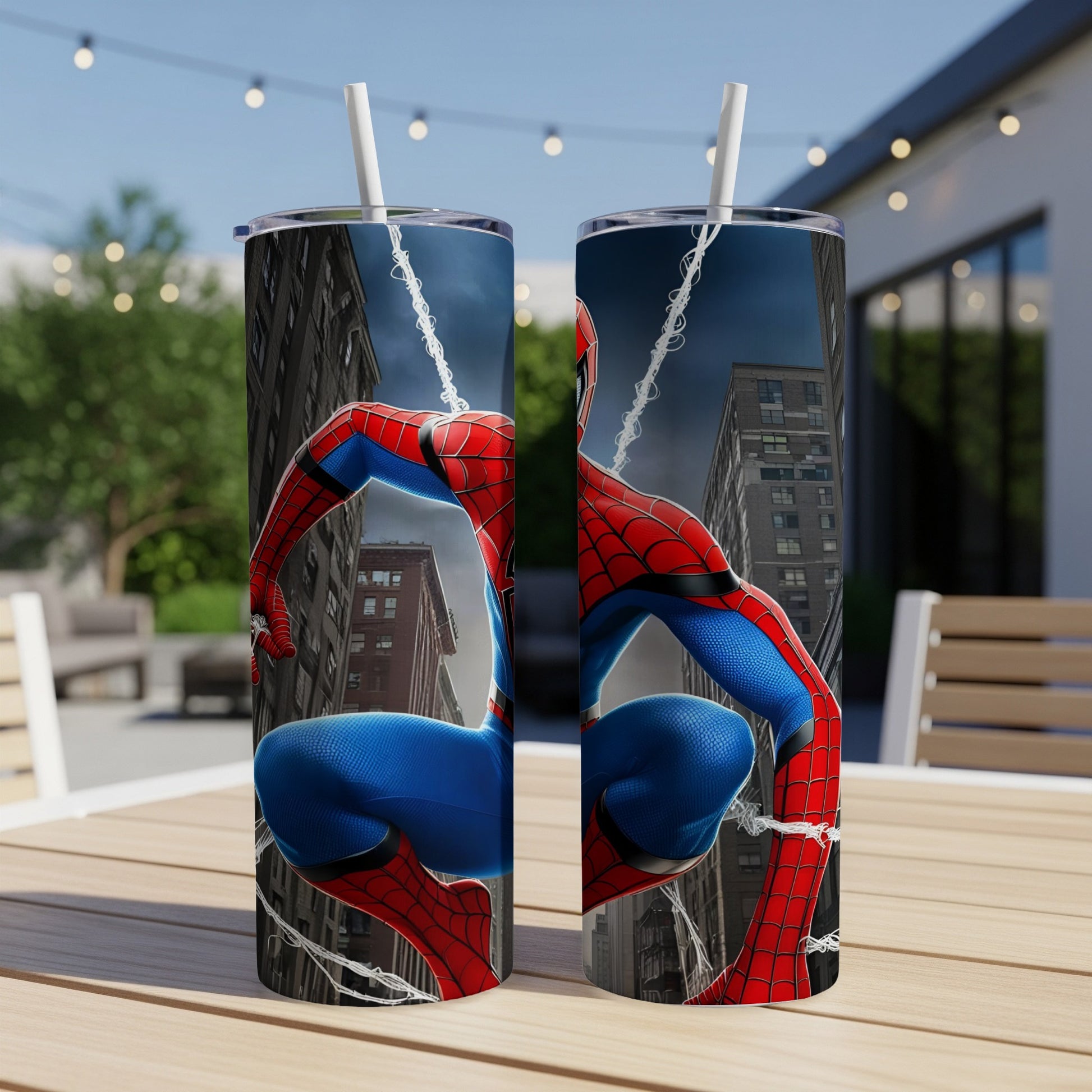Spider-Man crouches on a web against a city backdrop, depicted on two tumblers.