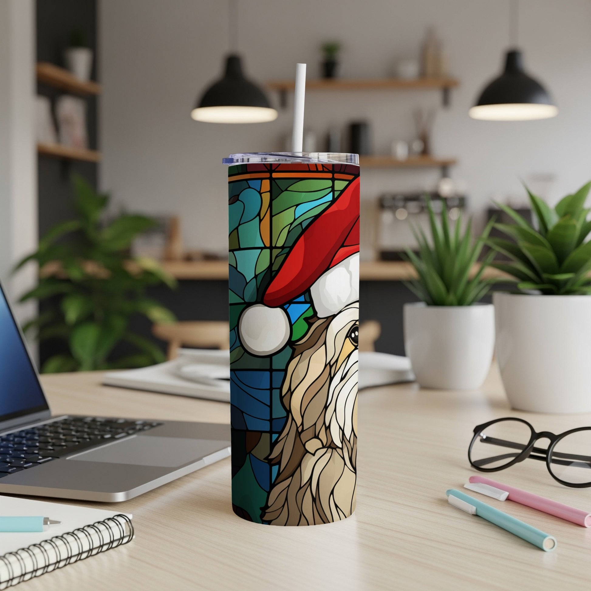 Stained glass tumbler with a dog wearing a Santa hat and a straw.