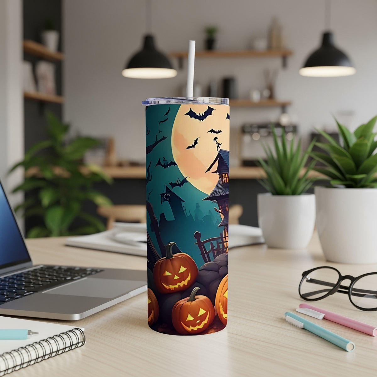 Tumbler with Halloween scene featuring jack-o'-lanterns, spooky house, and bats under a full moon.