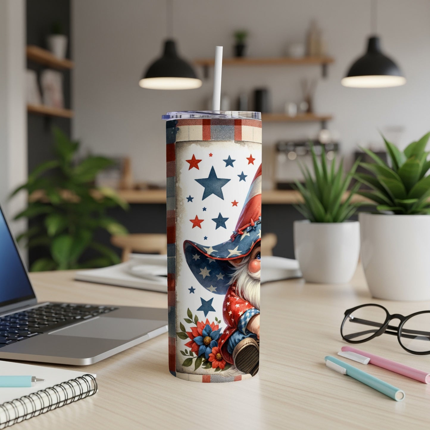 Red, white, and blue patriotic gnome tumbler with stars and flowers.
