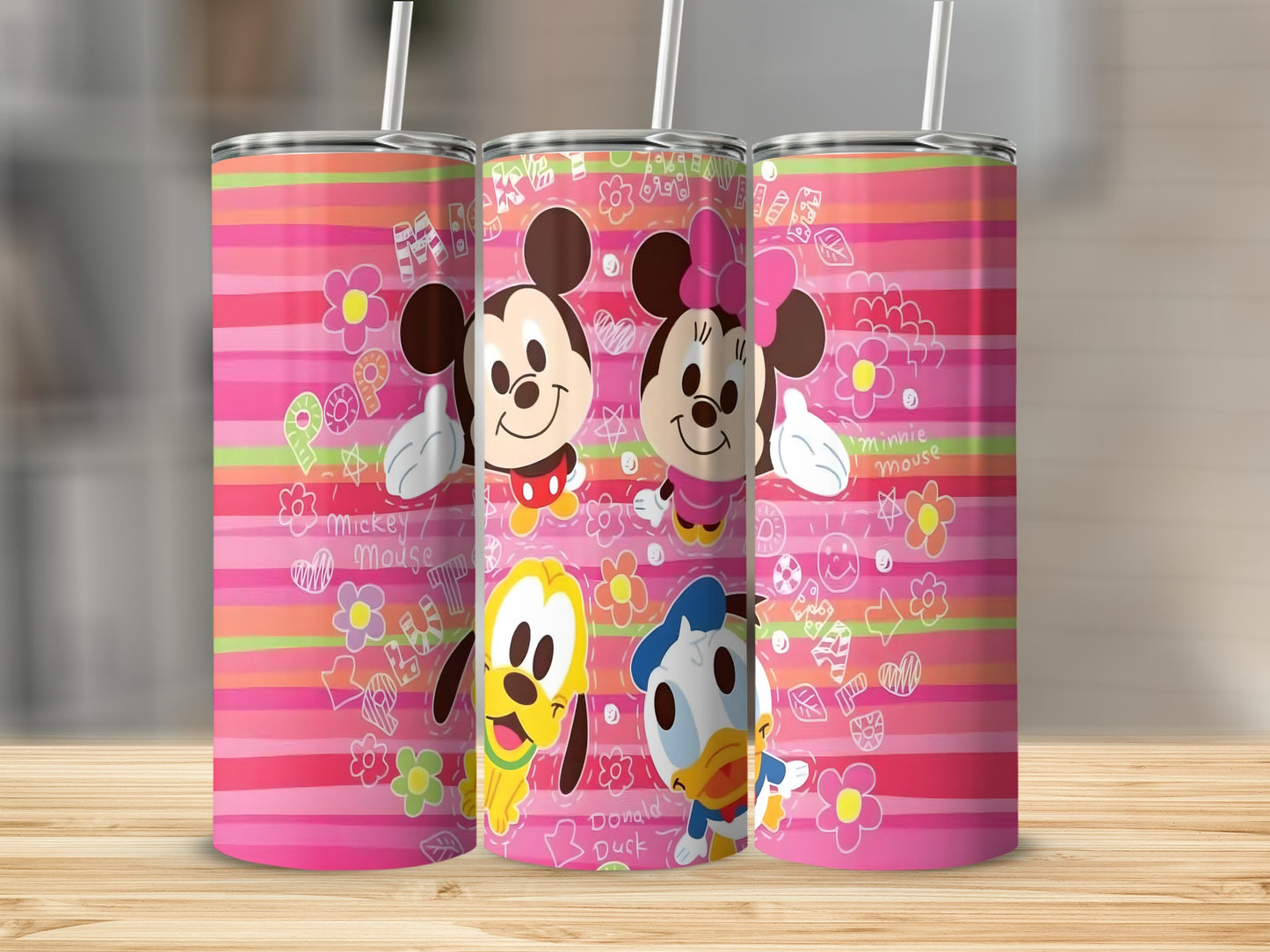 Three tumblers featuring Mickey, Minnie, Pluto, and Donald Duck with colorful stripes.