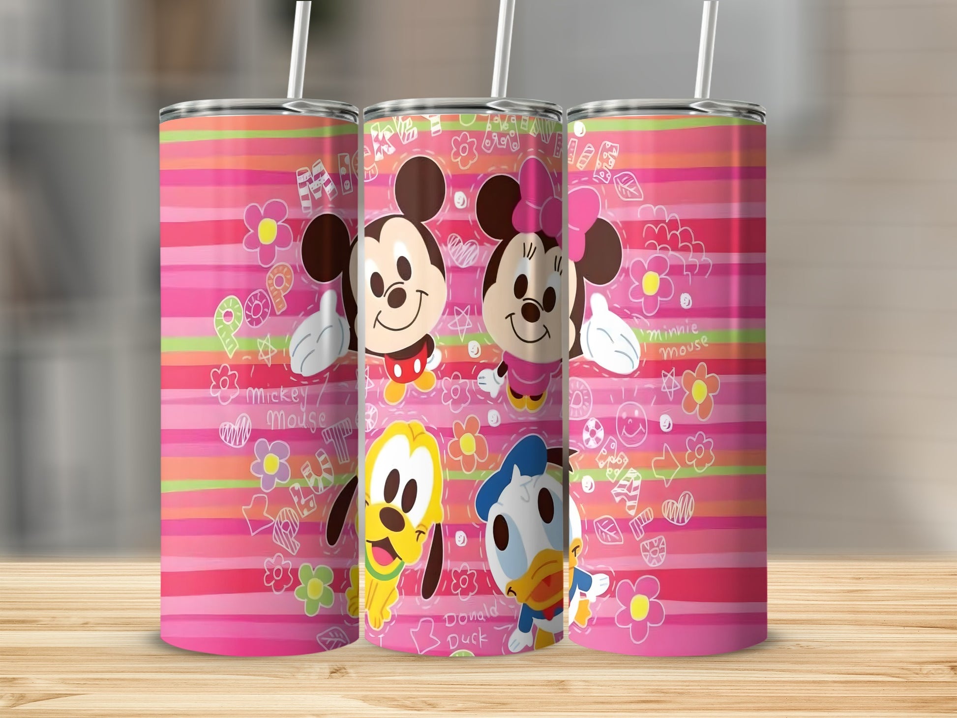 Three tumblers featuring Mickey, Minnie, Pluto, and Donald Duck with colorful stripes.