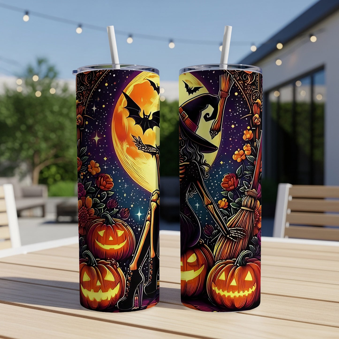 Two Halloween-themed tumblers with skeletons, pumpkins, bats, and a witch on a broom.