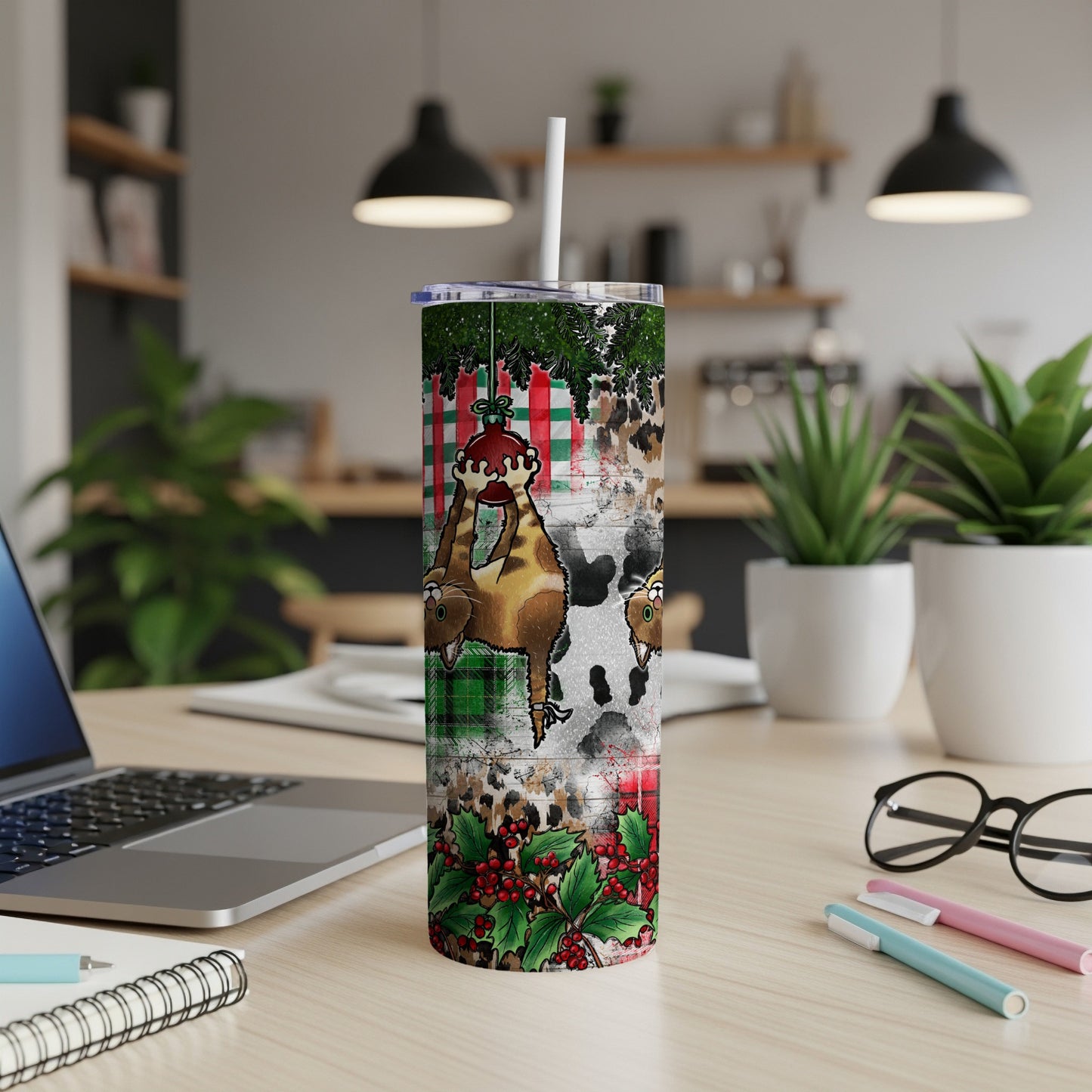 Christmas tumbler with cow and deer, plaid and holly design.