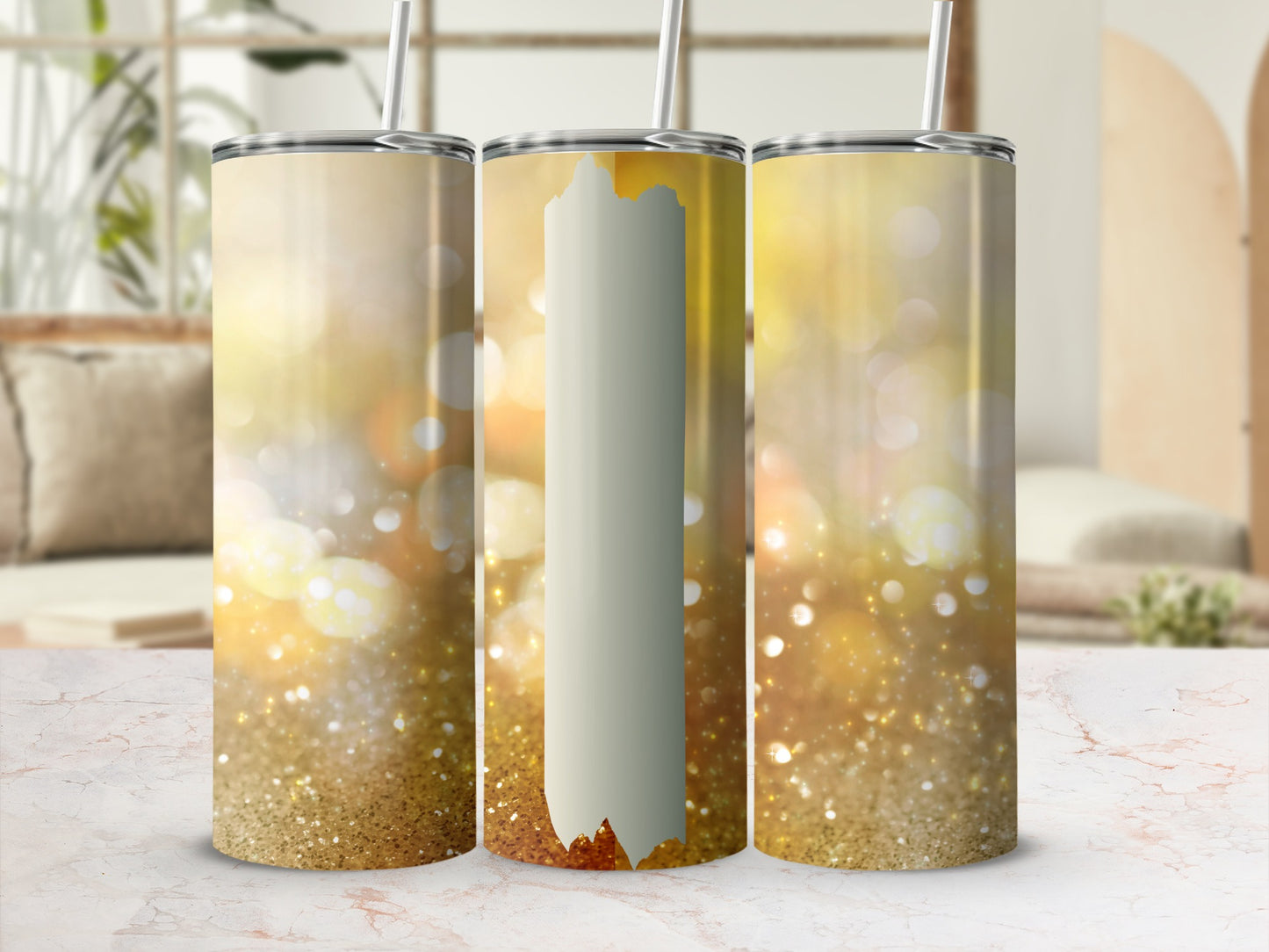 Three glittery tumblers with straw on a marble surface, blurred background.