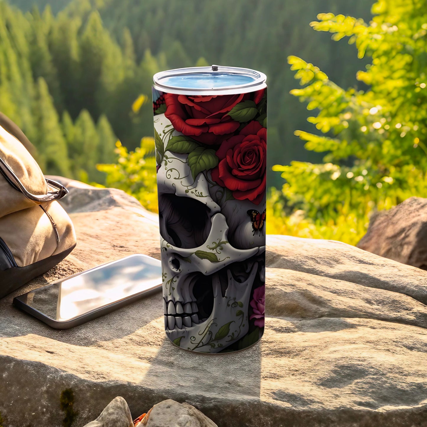 Skull and rose design on a stainless steel tumbler with a butterfly.
