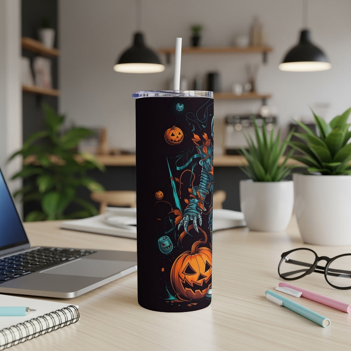 Halloween tumbler with a skeleton, pumpkins, and leaves design on a dark background.