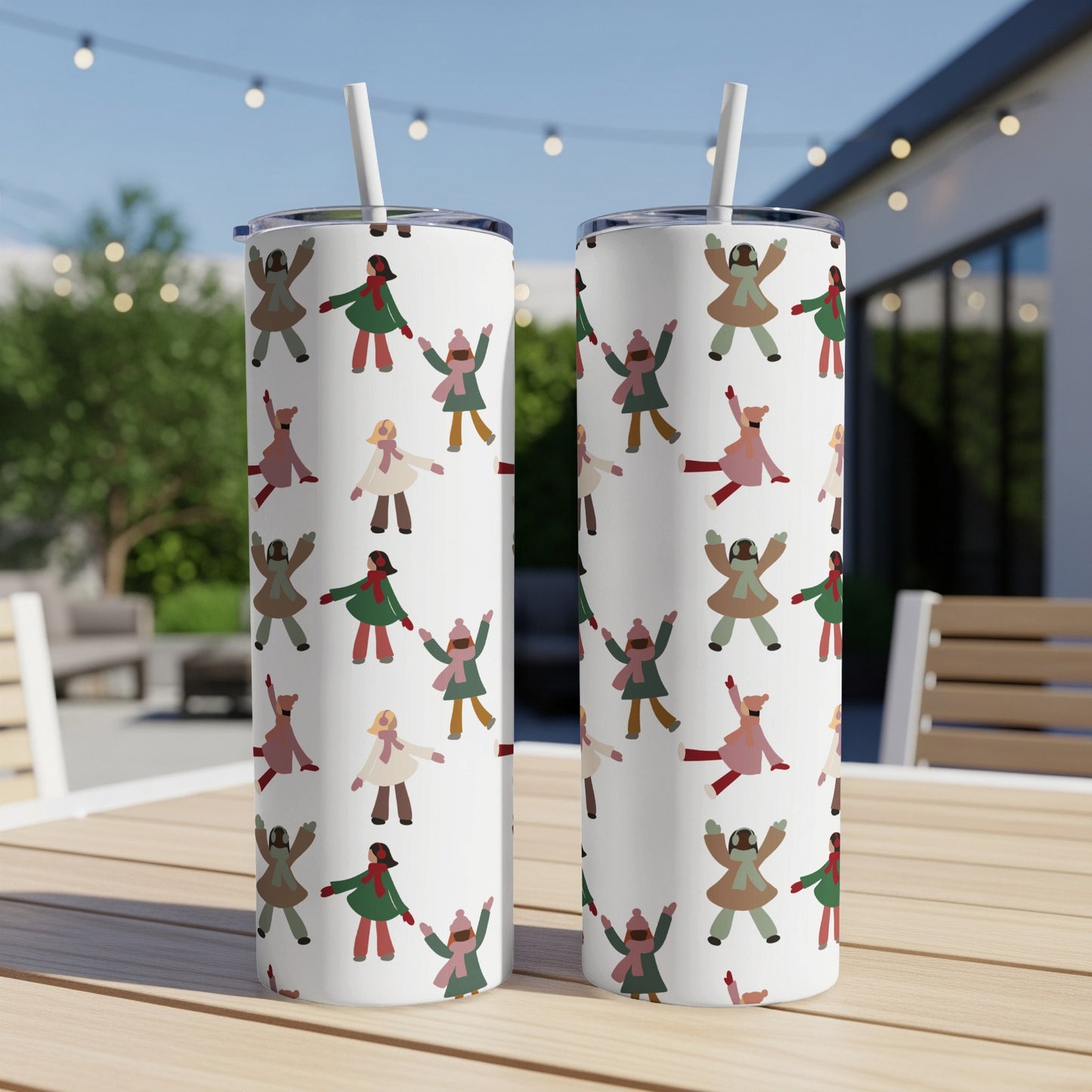 Two white tumblers with a playful pattern of diverse, smiling cartoon figures.
