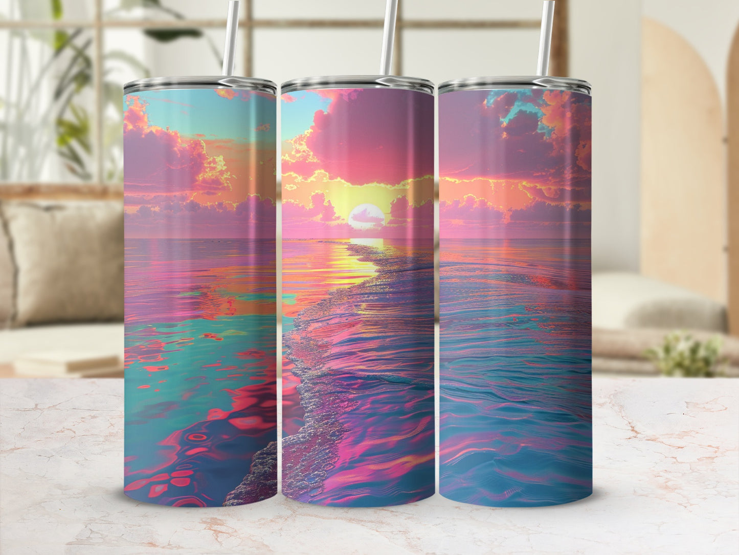 Three tumblers display a colorful sunset over a vibrant ocean.