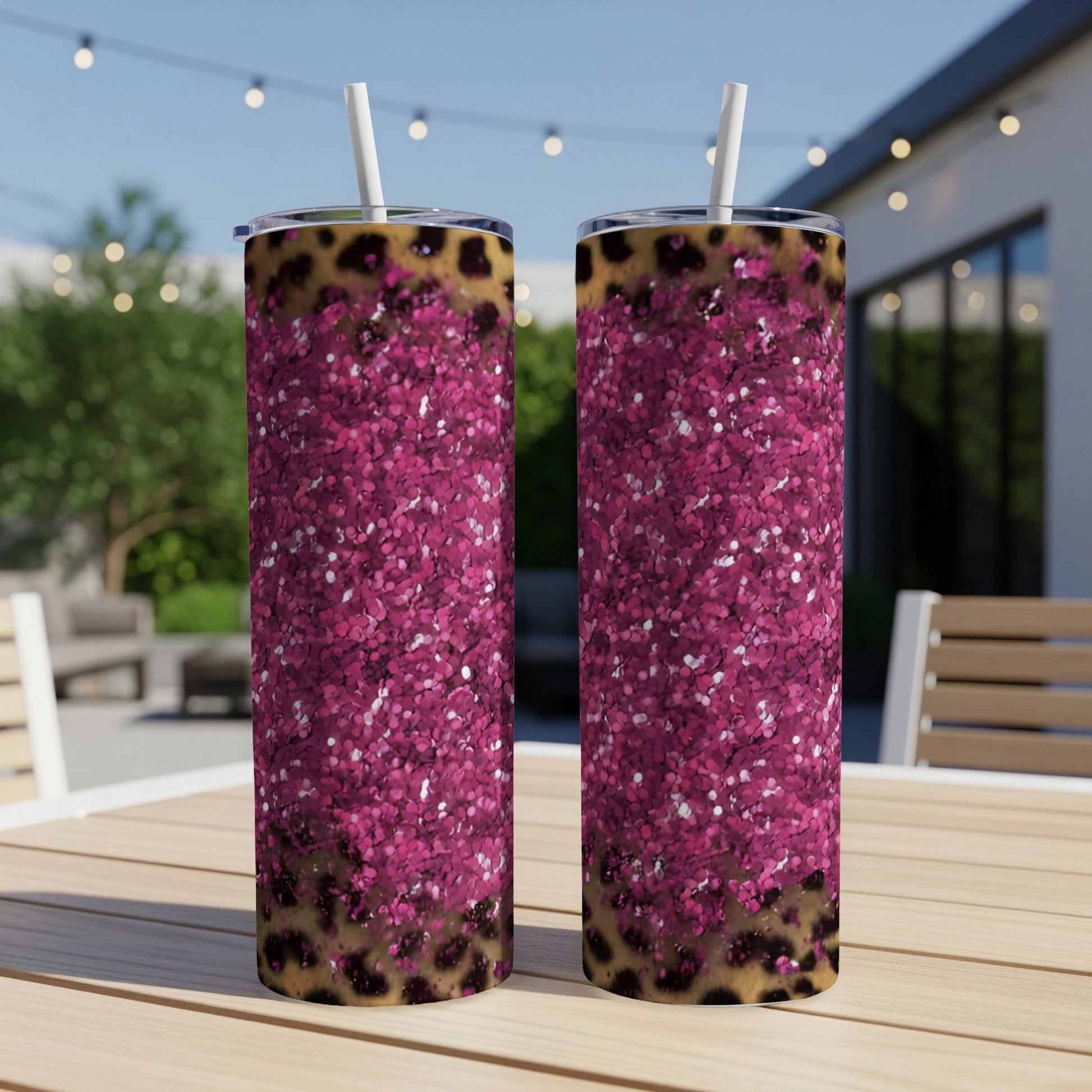 Two tall tumblers with pink glitter and leopard print design.