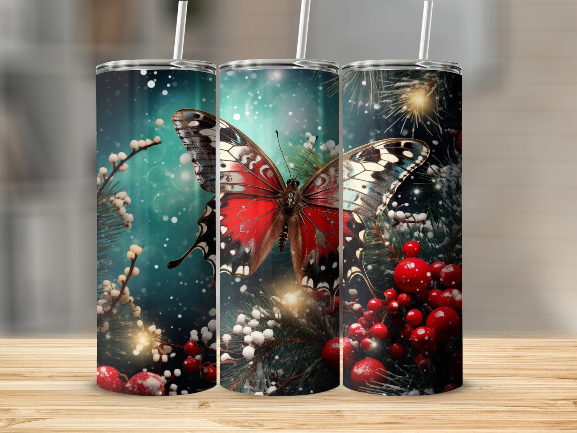 Three tumblers decorated with a red butterfly, berries, and pine branches.