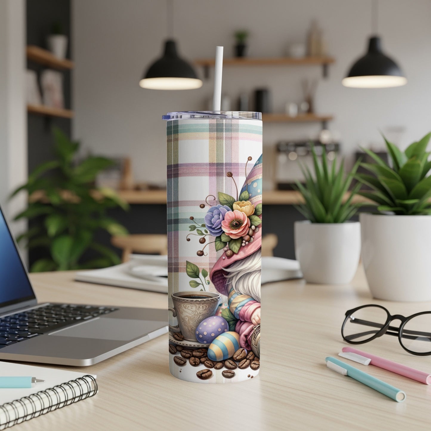 Gnome tumbler with Easter eggs and coffee cup, plaid background.
