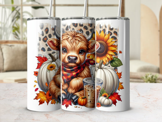 Cow with sunflower and pumpkins on a tumbler.