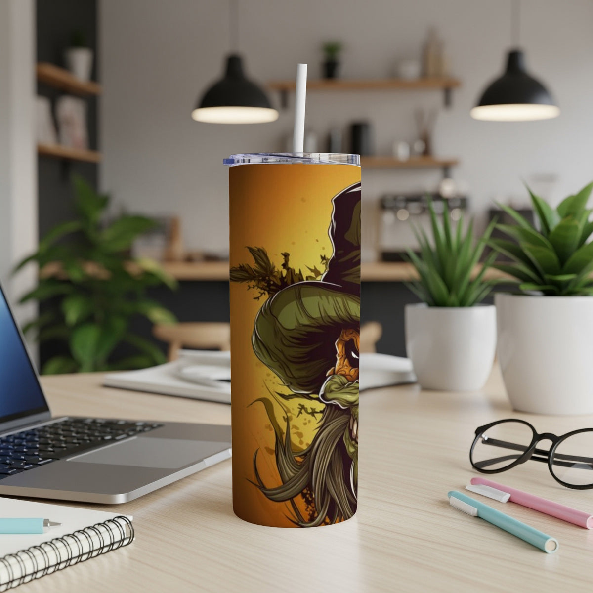 Tumbler with a cartoon grim reaper design on an orange background.