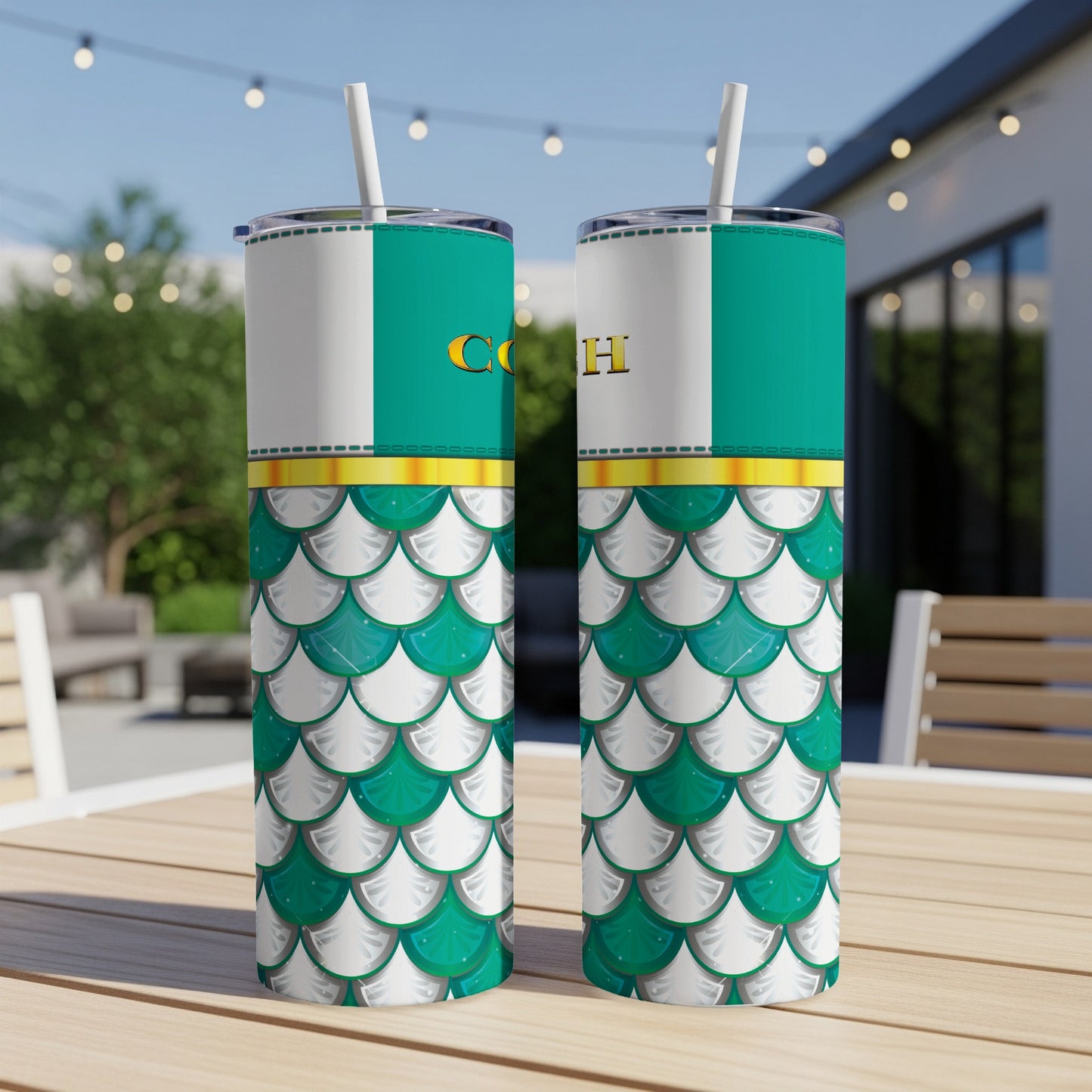 Two tumblers with white, green, and gold scales and "CO H" text.