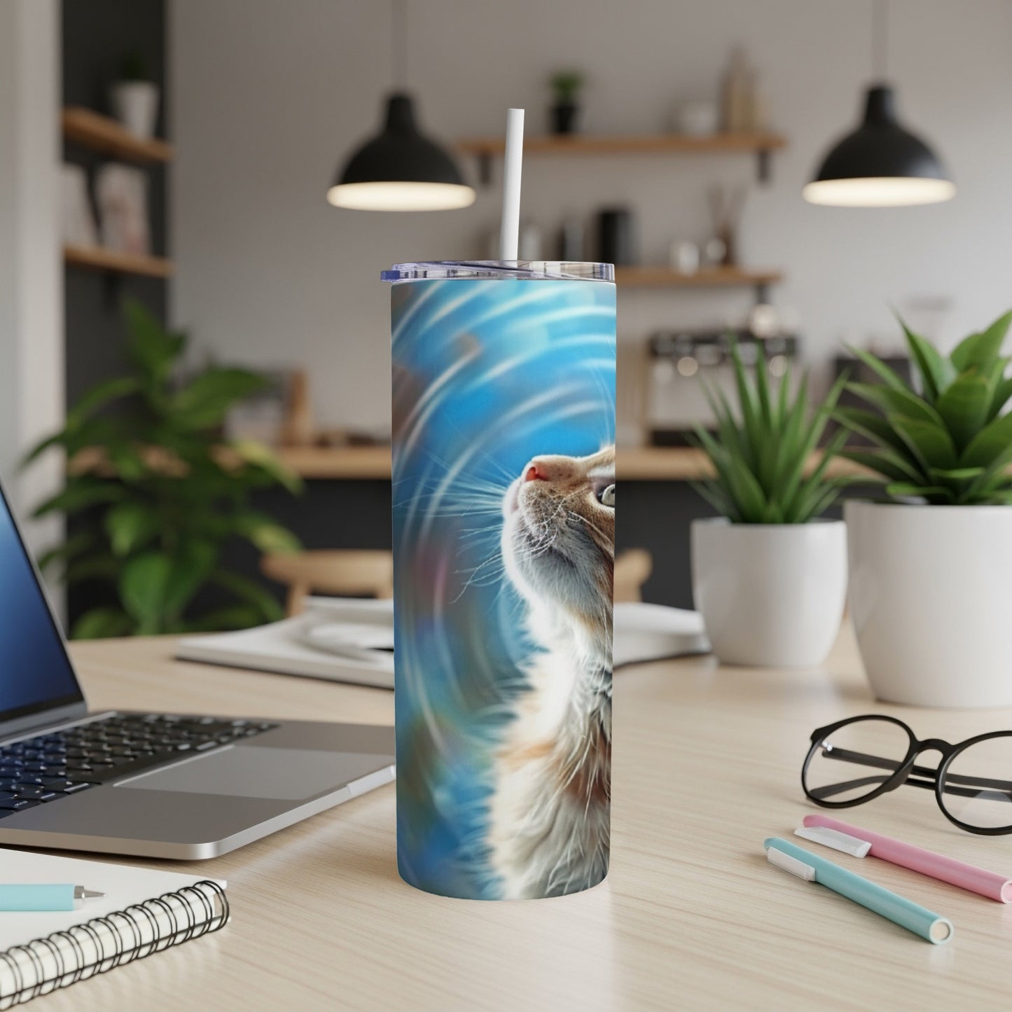 Furry cat on a blue, swirled background on a tumbler.
