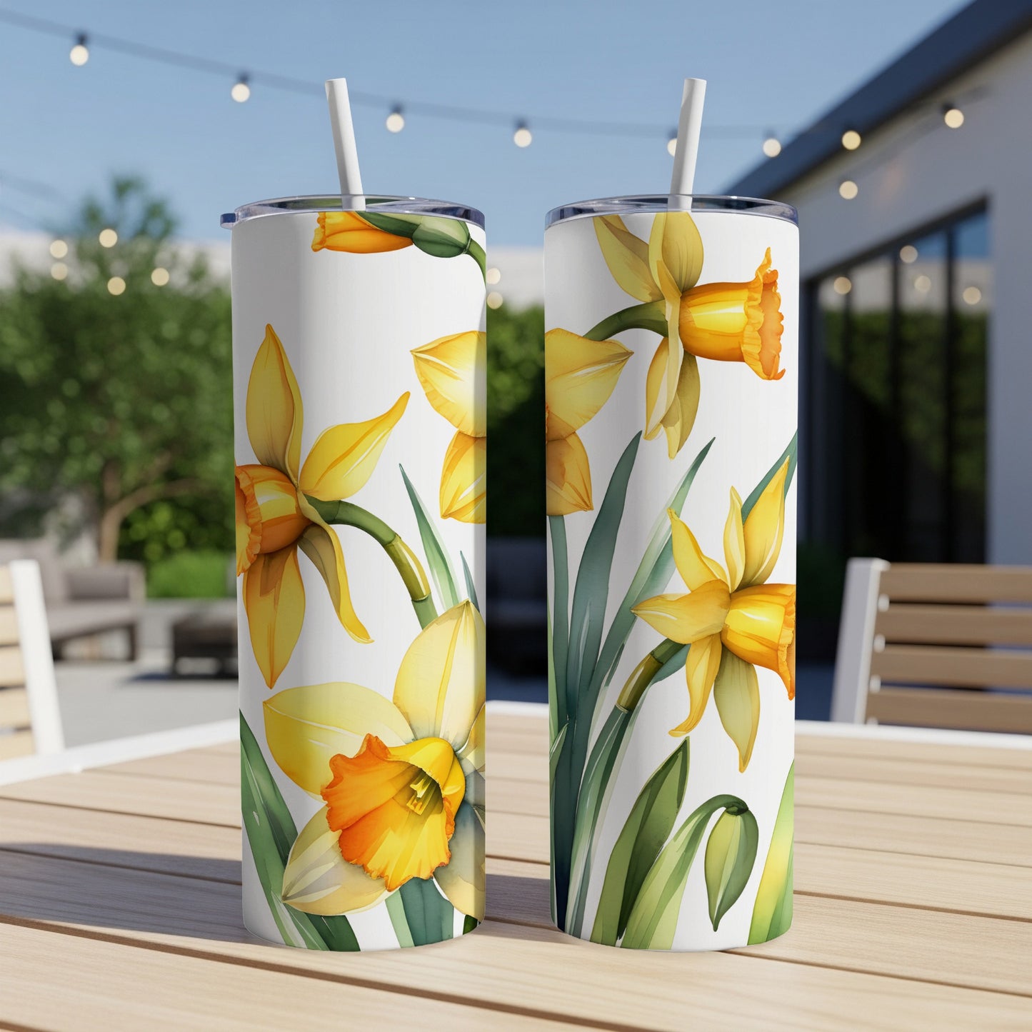 Two white tumblers with yellow daffodils and green leaves design.