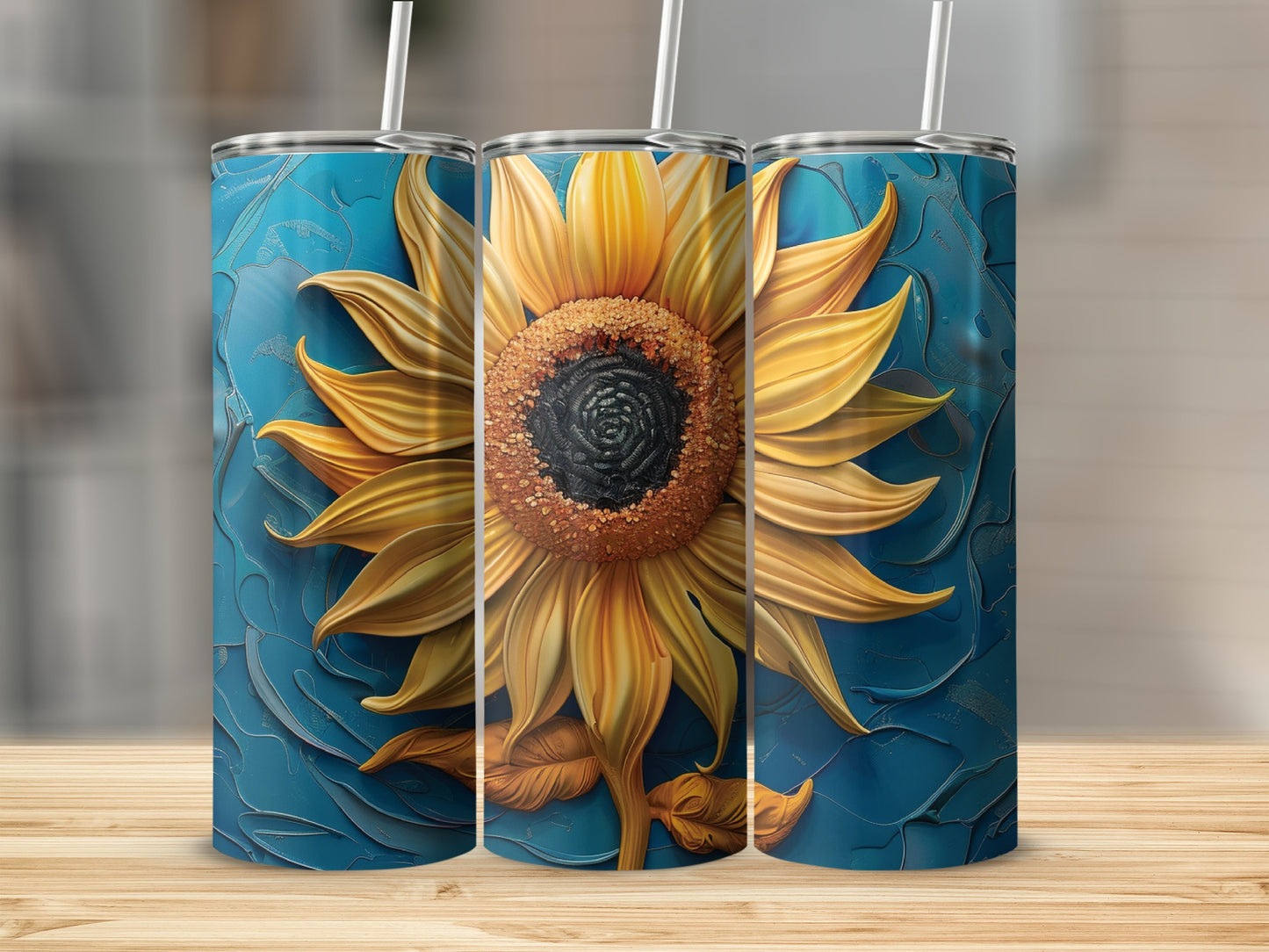 Three tumblers featuring a large, detailed sunflower on a textured blue background.