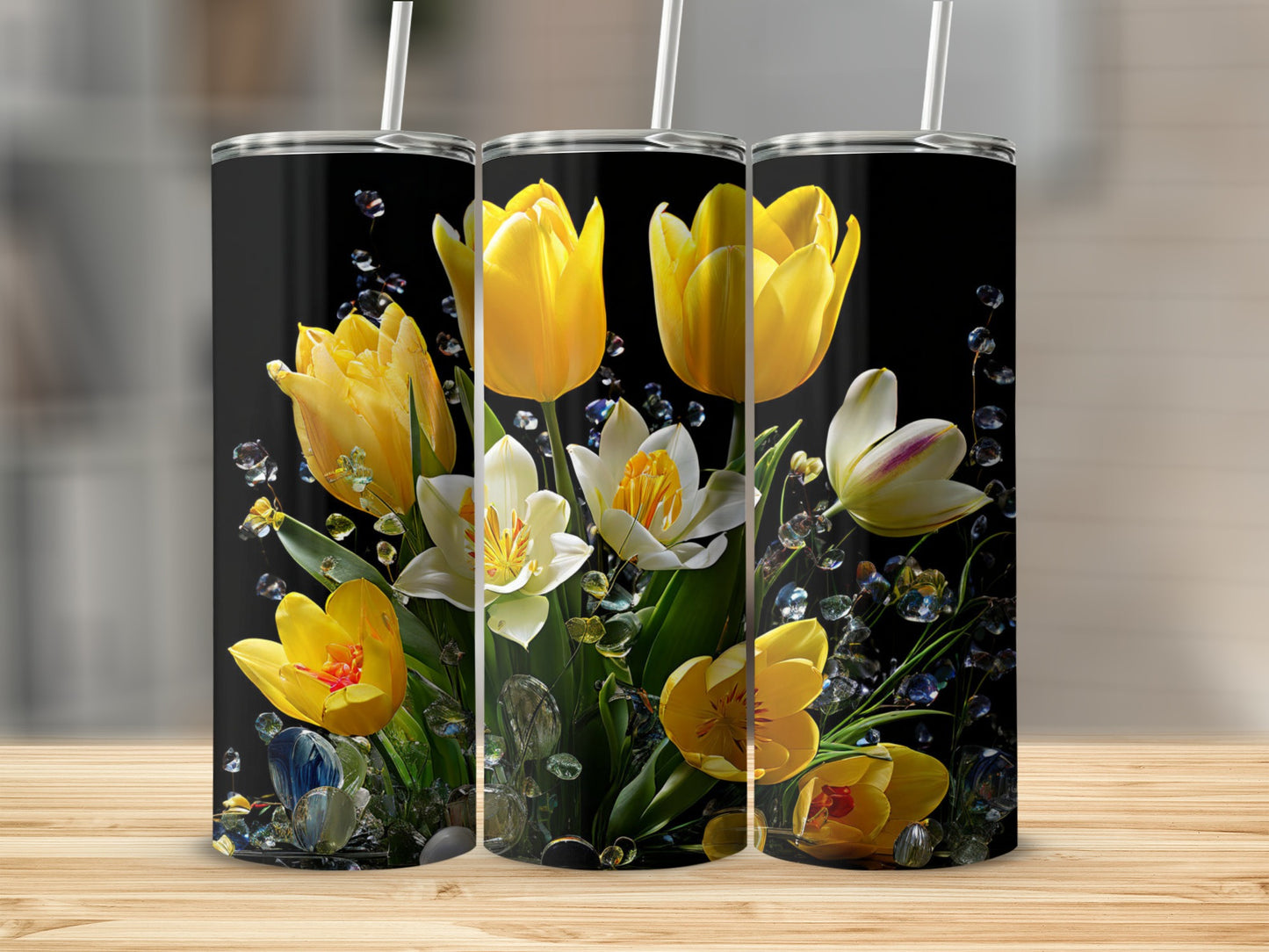 Three tumblers featuring a floral design with yellow and white tulips and dew drops.