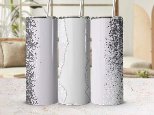 Three tumblers with glitter and torn paper designs.