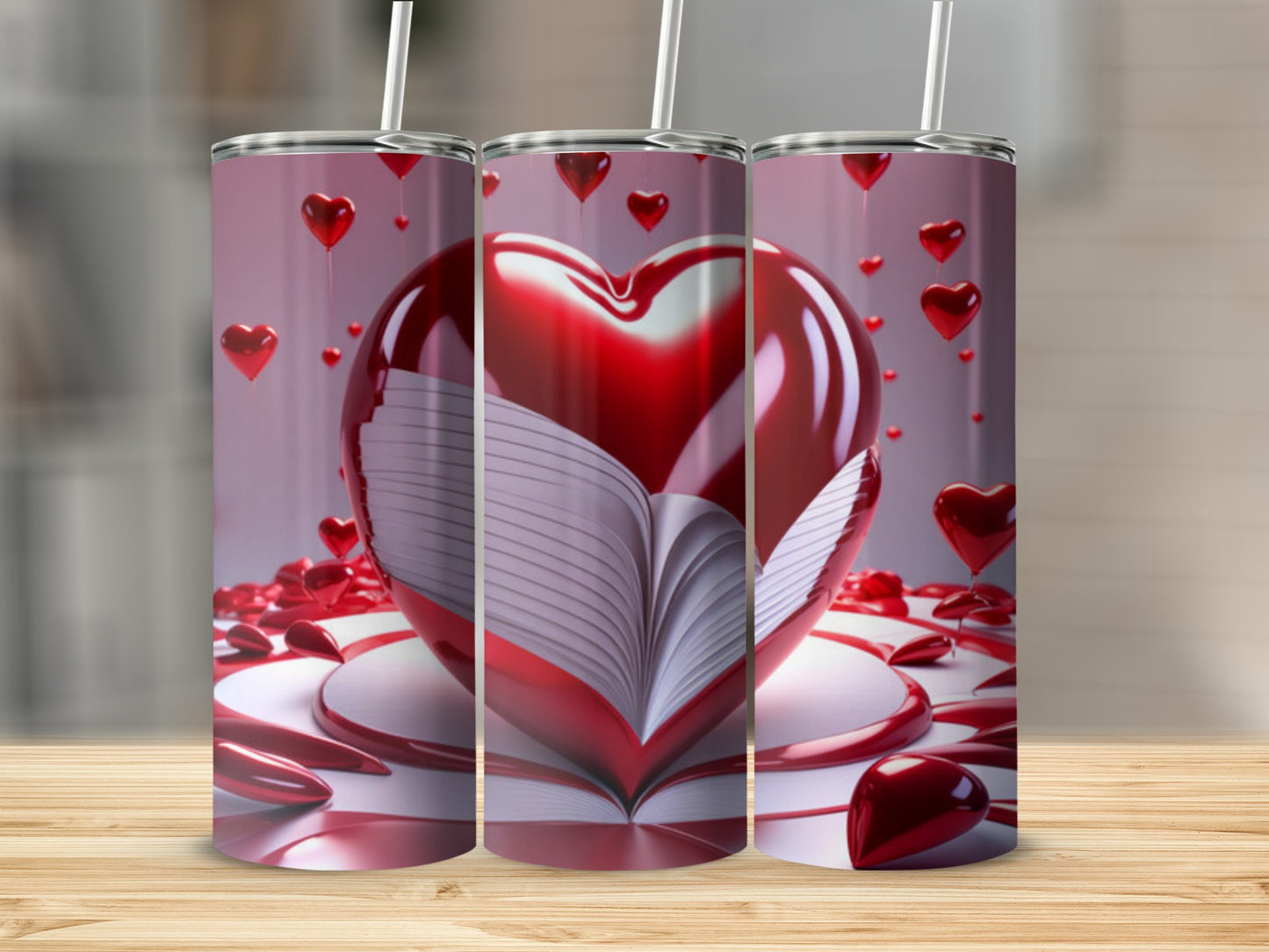 Three tumblers displaying an open book with a large heart on top.
