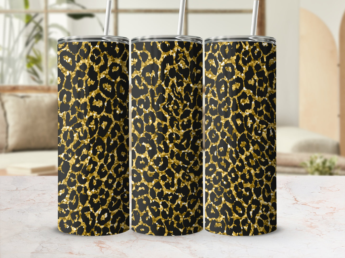 Three tumblers with a black and gold leopard print pattern.