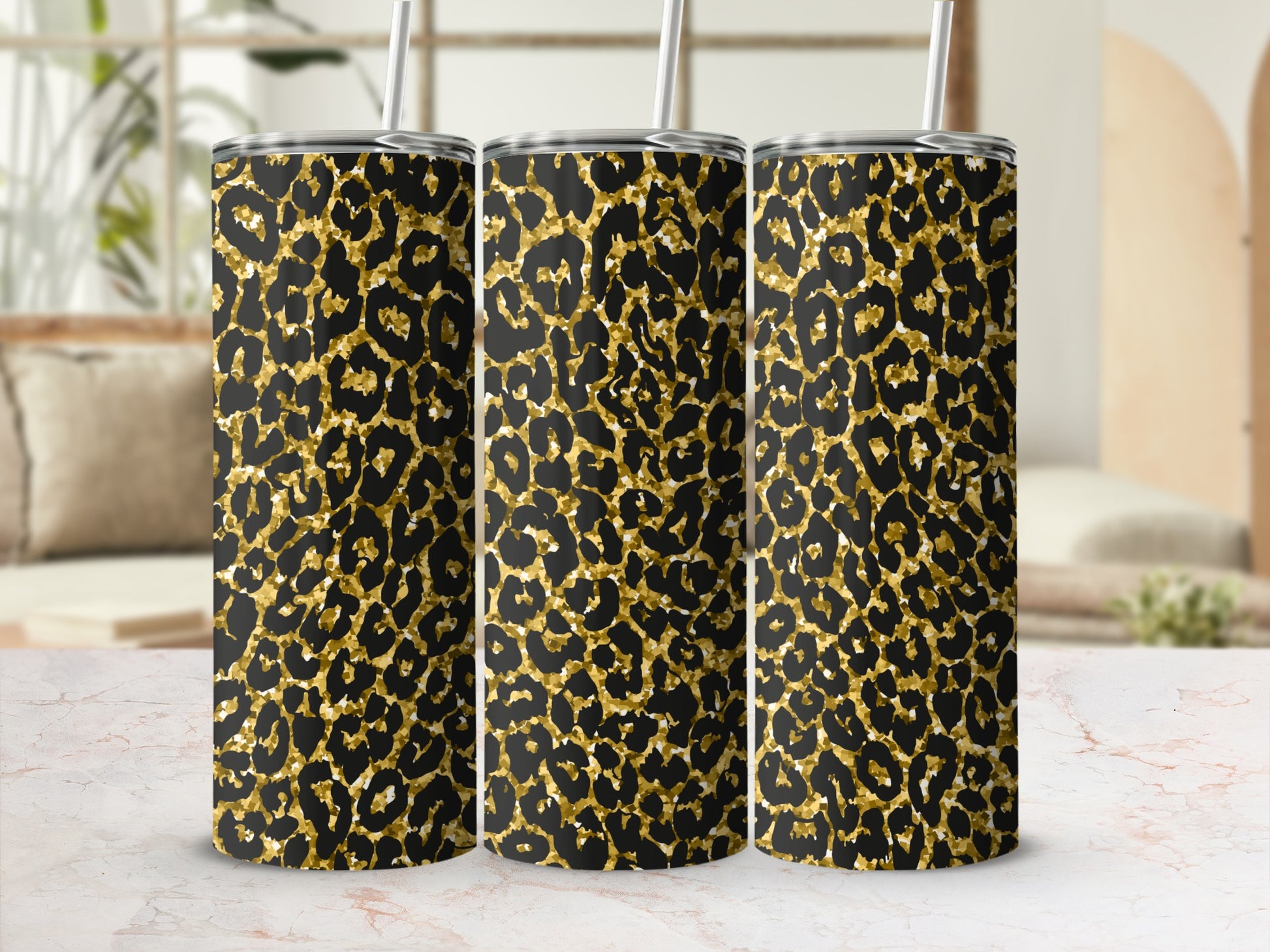 Three tumblers with a black and gold leopard print pattern.