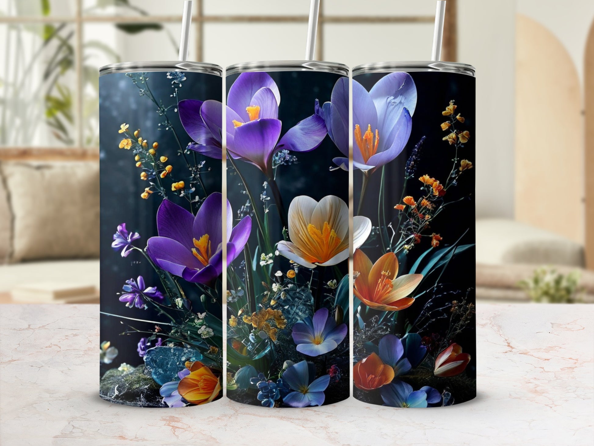 Three tumblers featuring purple and orange floral designs with blue accents.