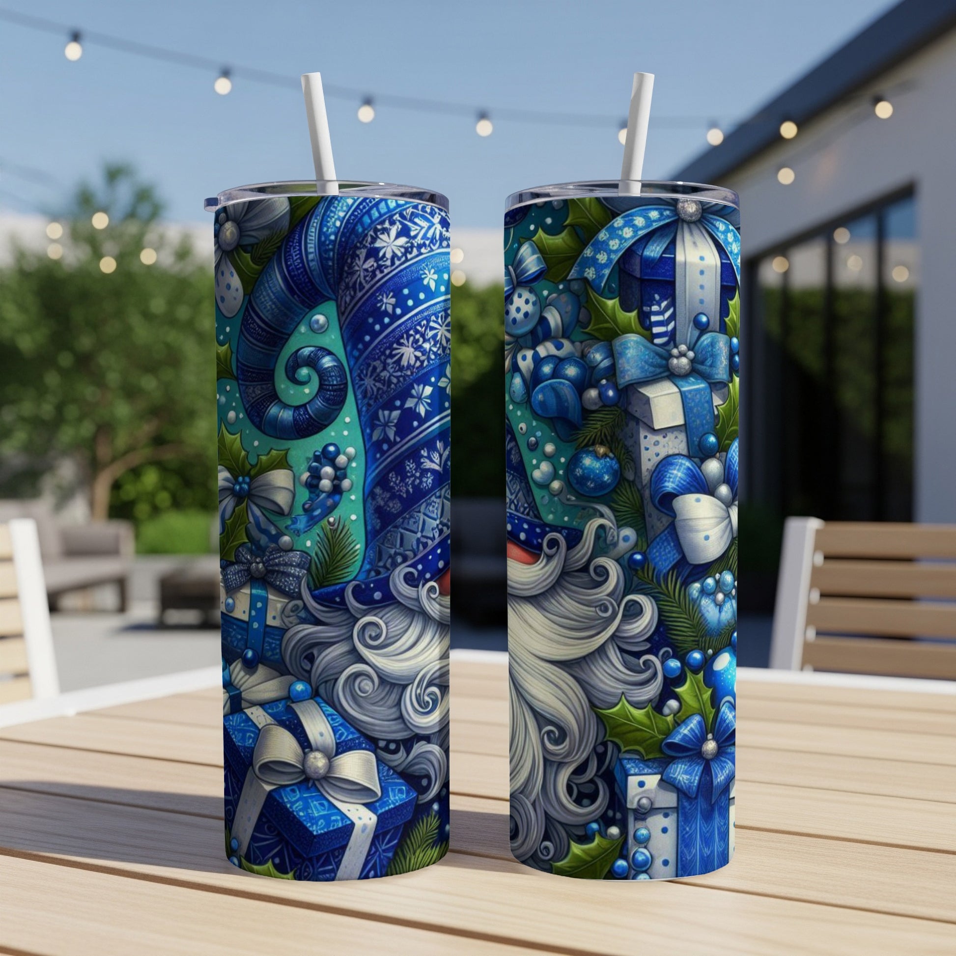 Two tumblers with a blue and white Santa Claus pattern and gift boxes.