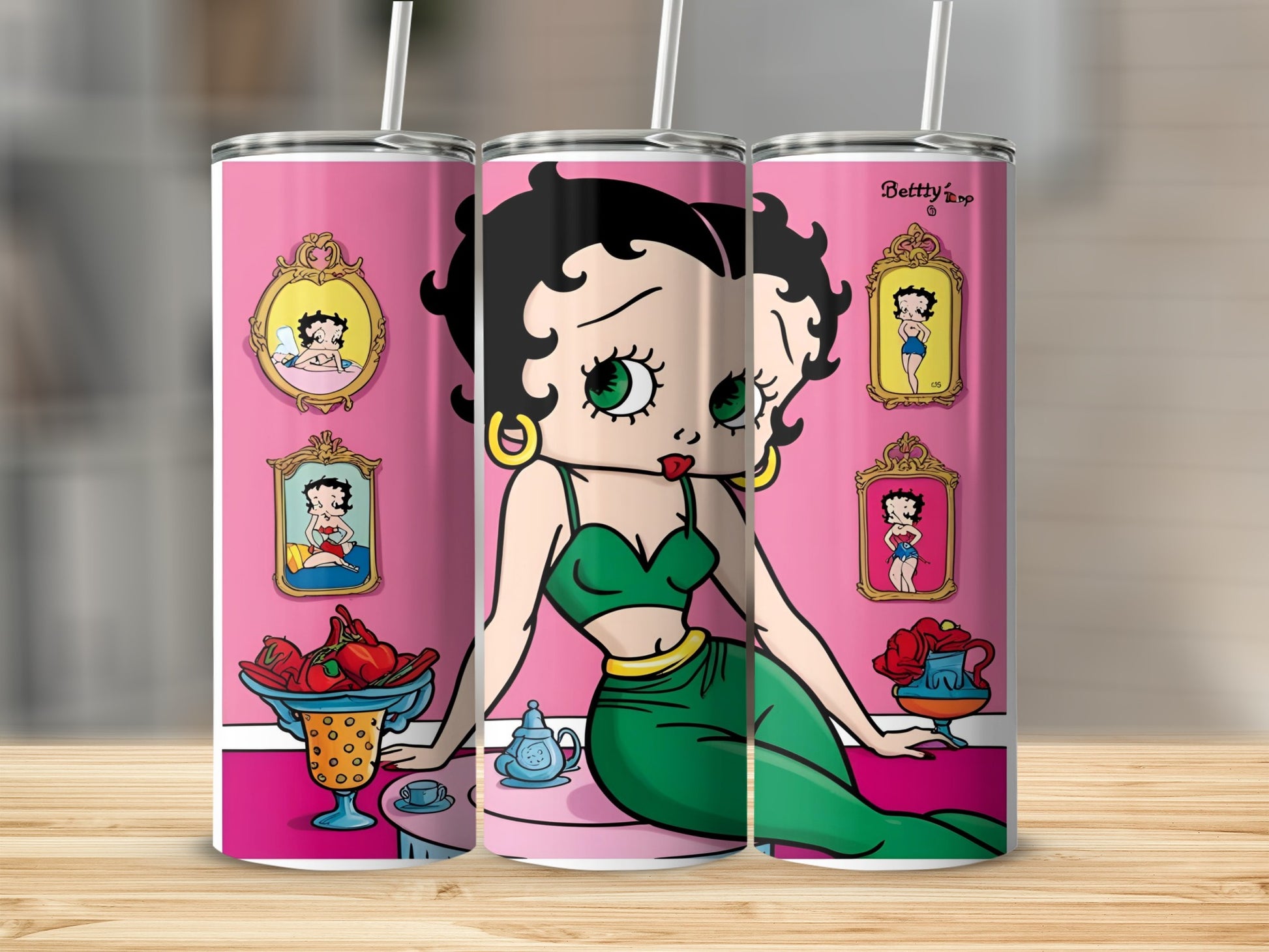 Betty Boop illustration on pink background with framed pictures and a tea set.
