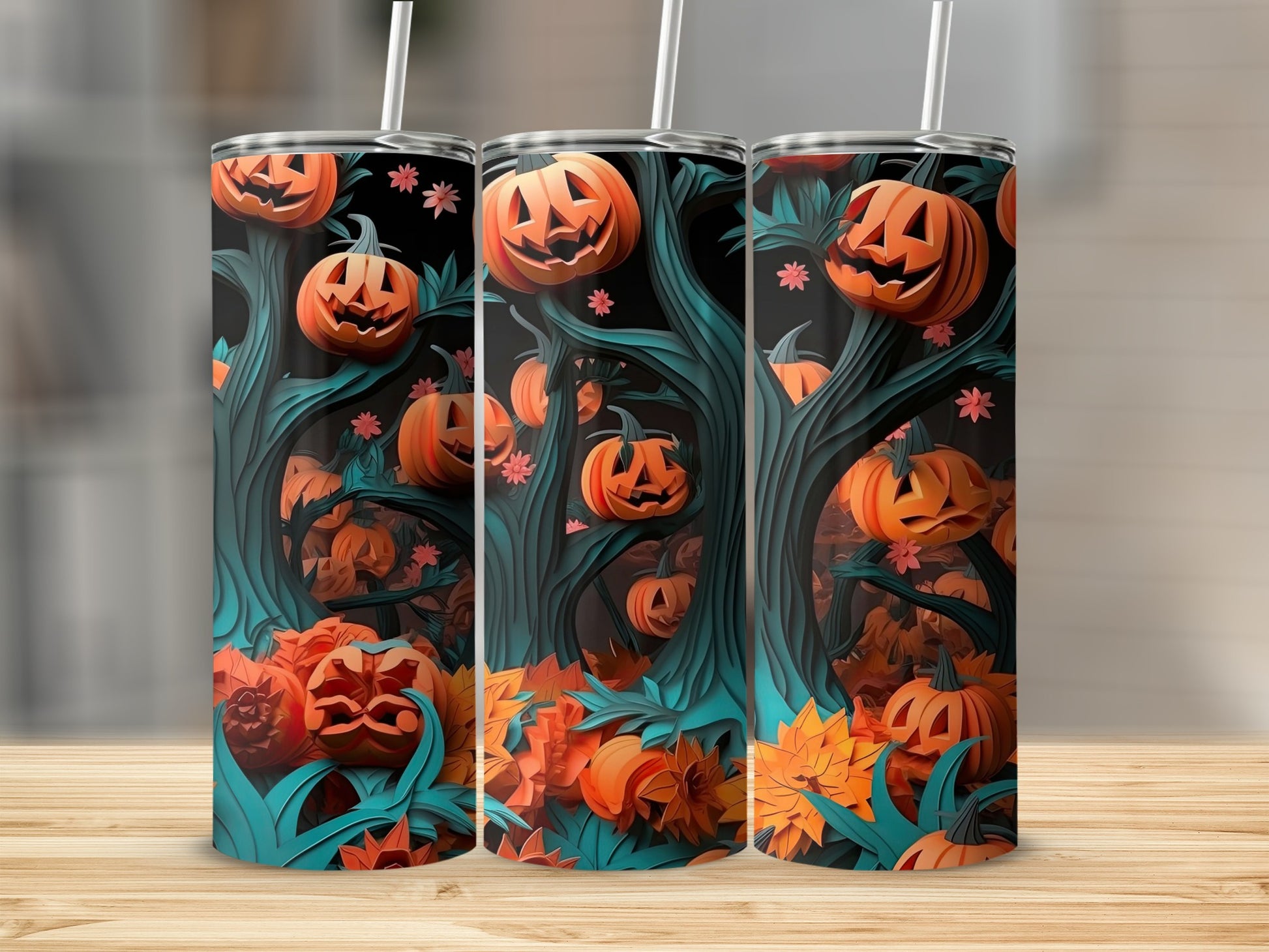 Three tumblers with a Halloween forest design featuring jack-o'-lanterns and autumn leaves.