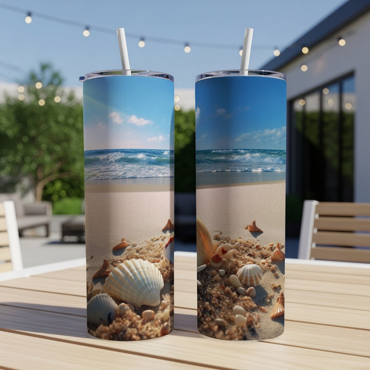 Beach scene with shells and ocean on two tumblers.