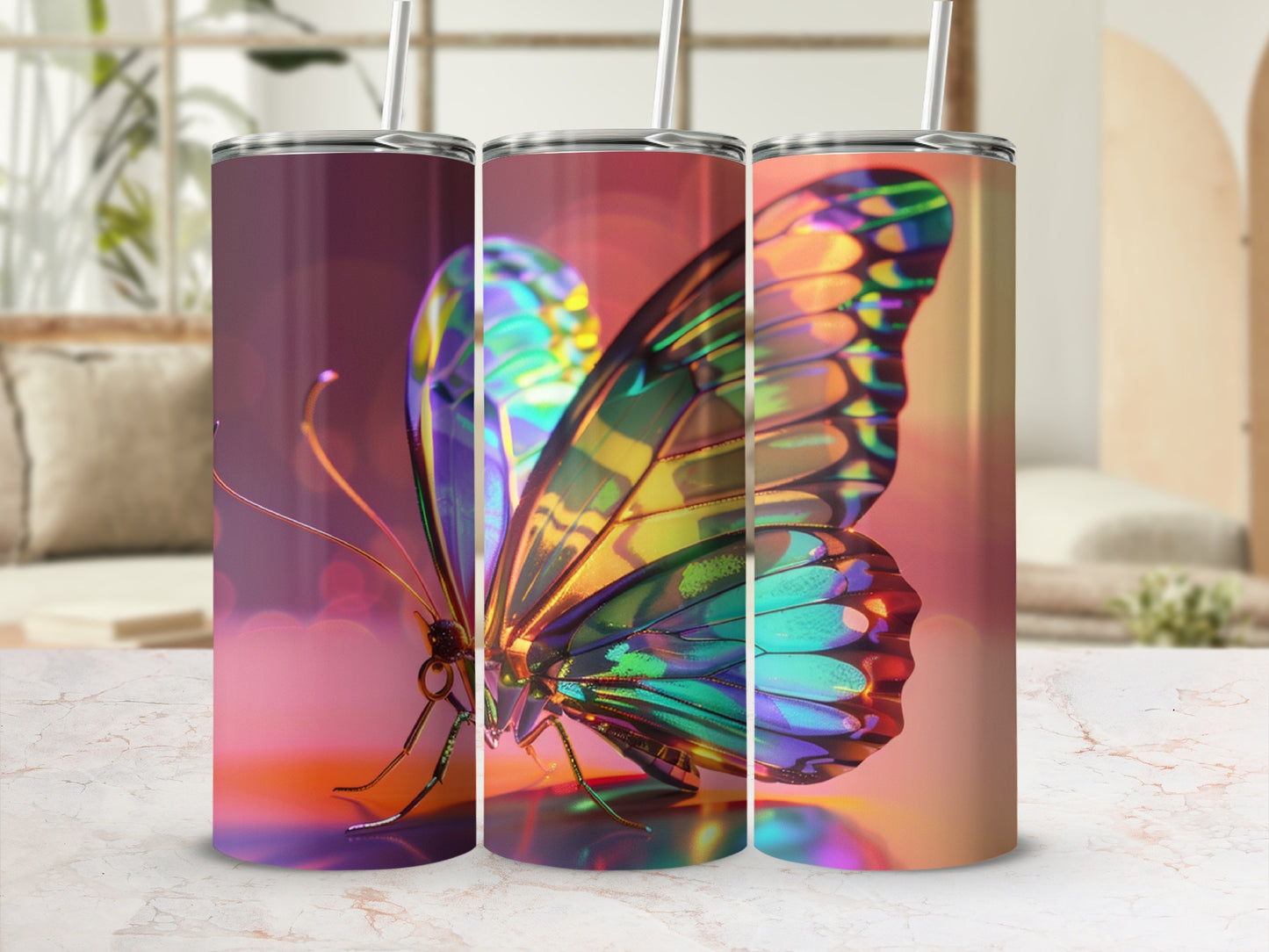 Three iridescent butterfly tumblers with straws arranged in a row.