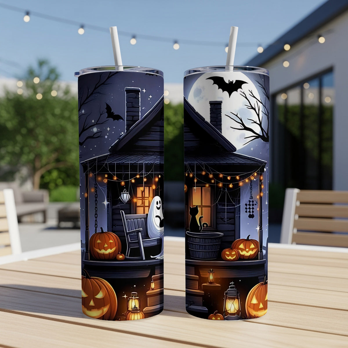 Halloween tumbler with spooky house, pumpkins, ghost, bat, and black cat.