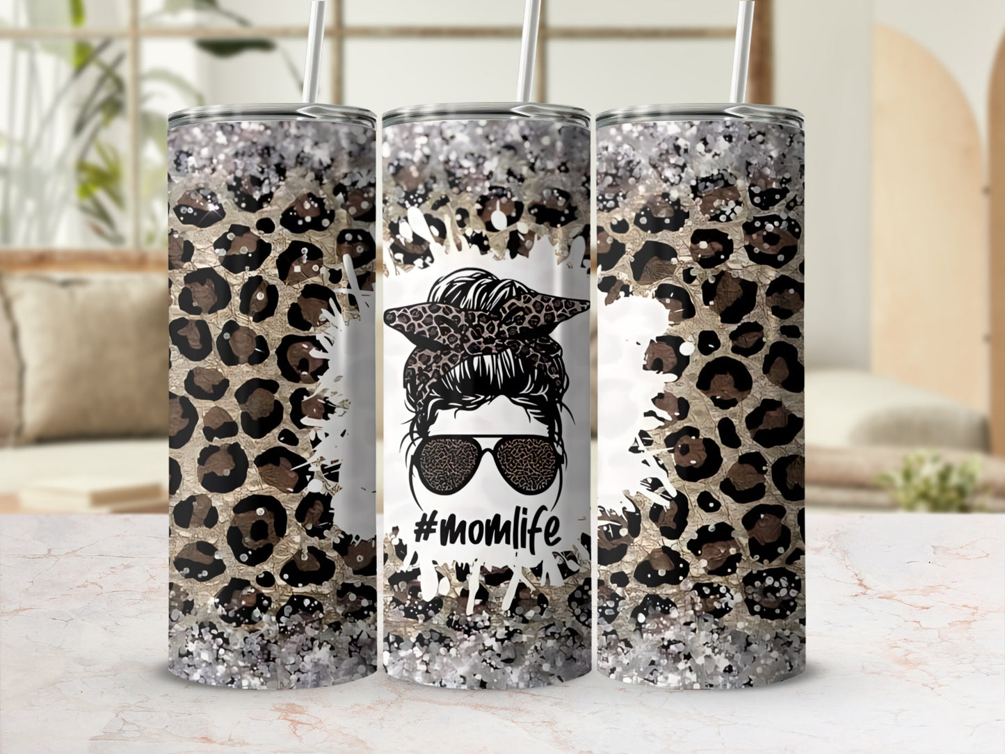 Tumbler with leopard print, glitter, sunglasses, and "#momlife" text.