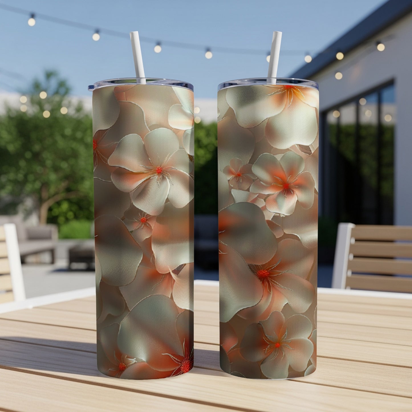 Two tall tumblers with a floral pattern featuring light pink and white flowers.