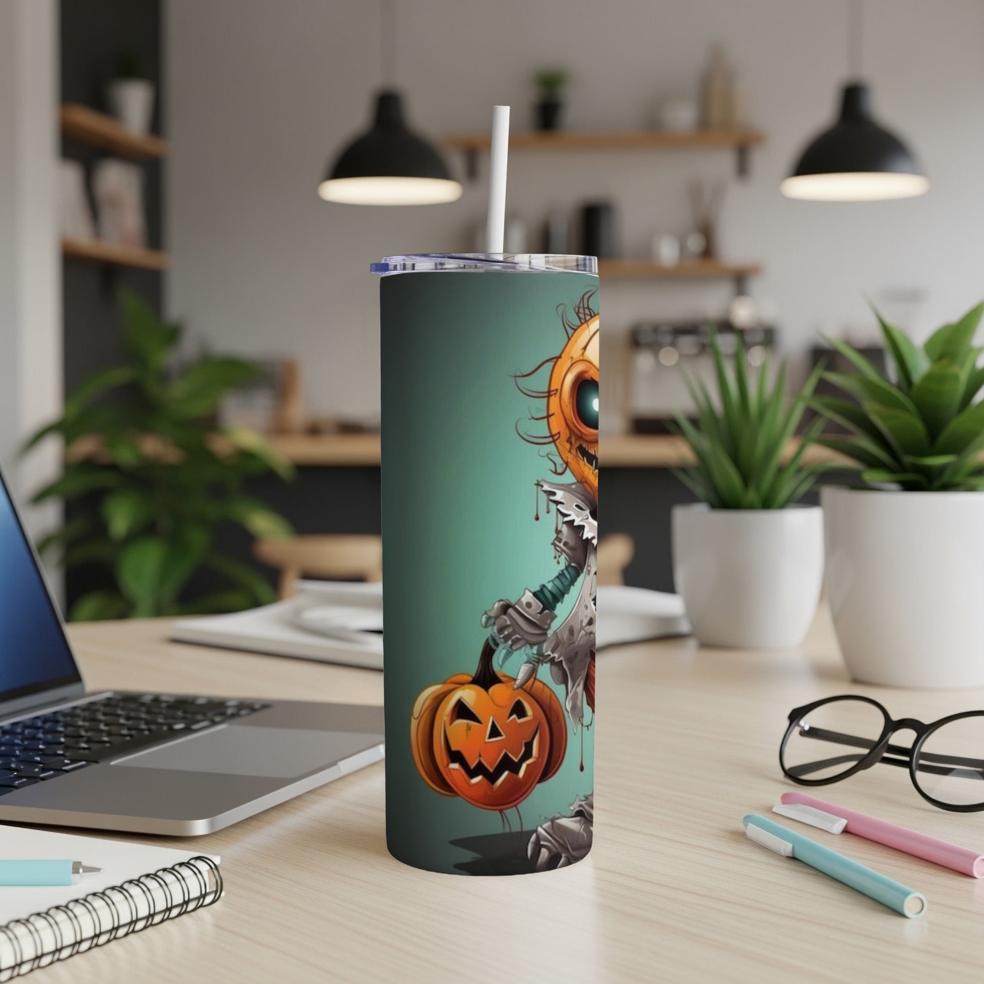 Tall tumbler with a cartoon pumpkin character and a straw.