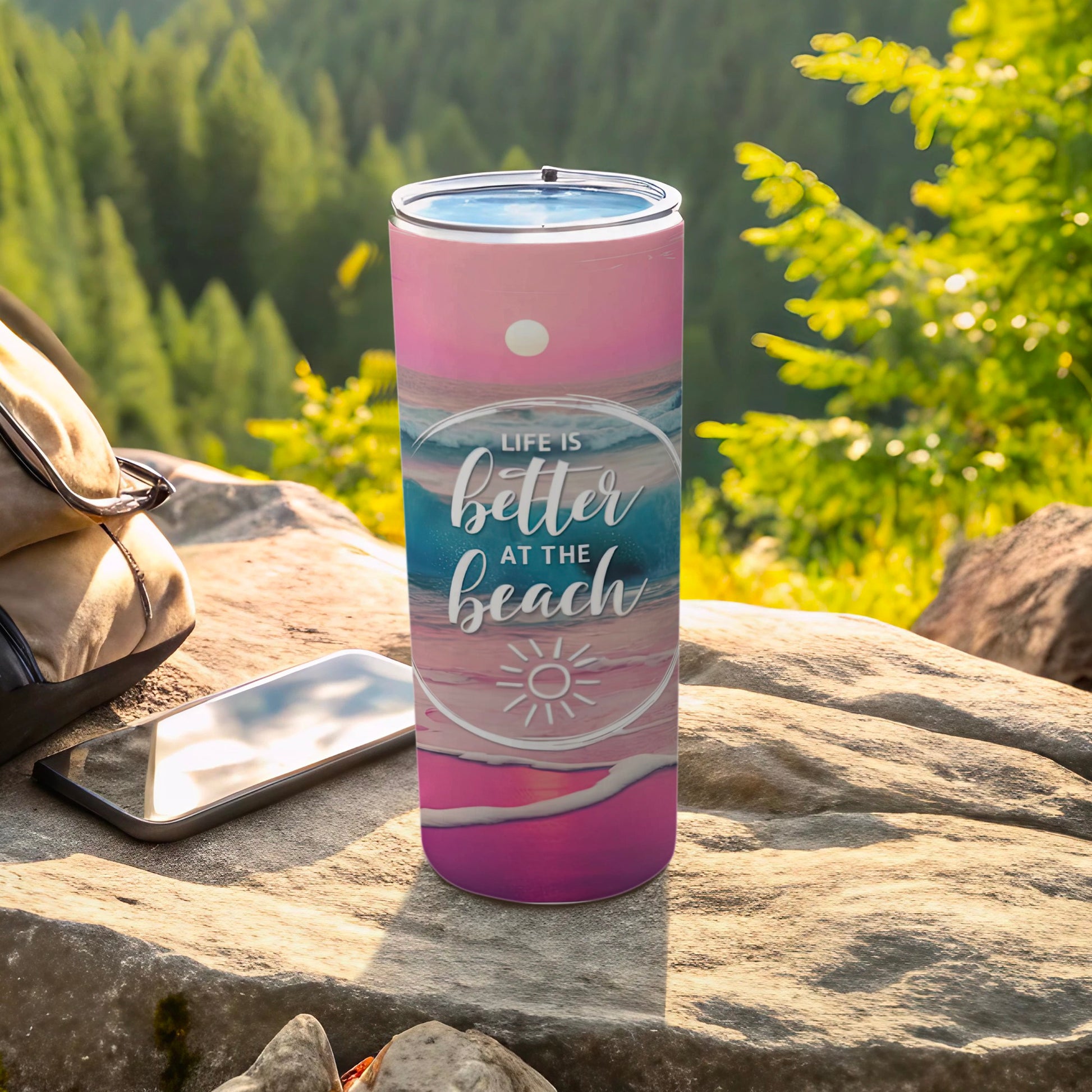 Pink and purple tumbler with "Life is Better at the Beach" text and ocean waves.
