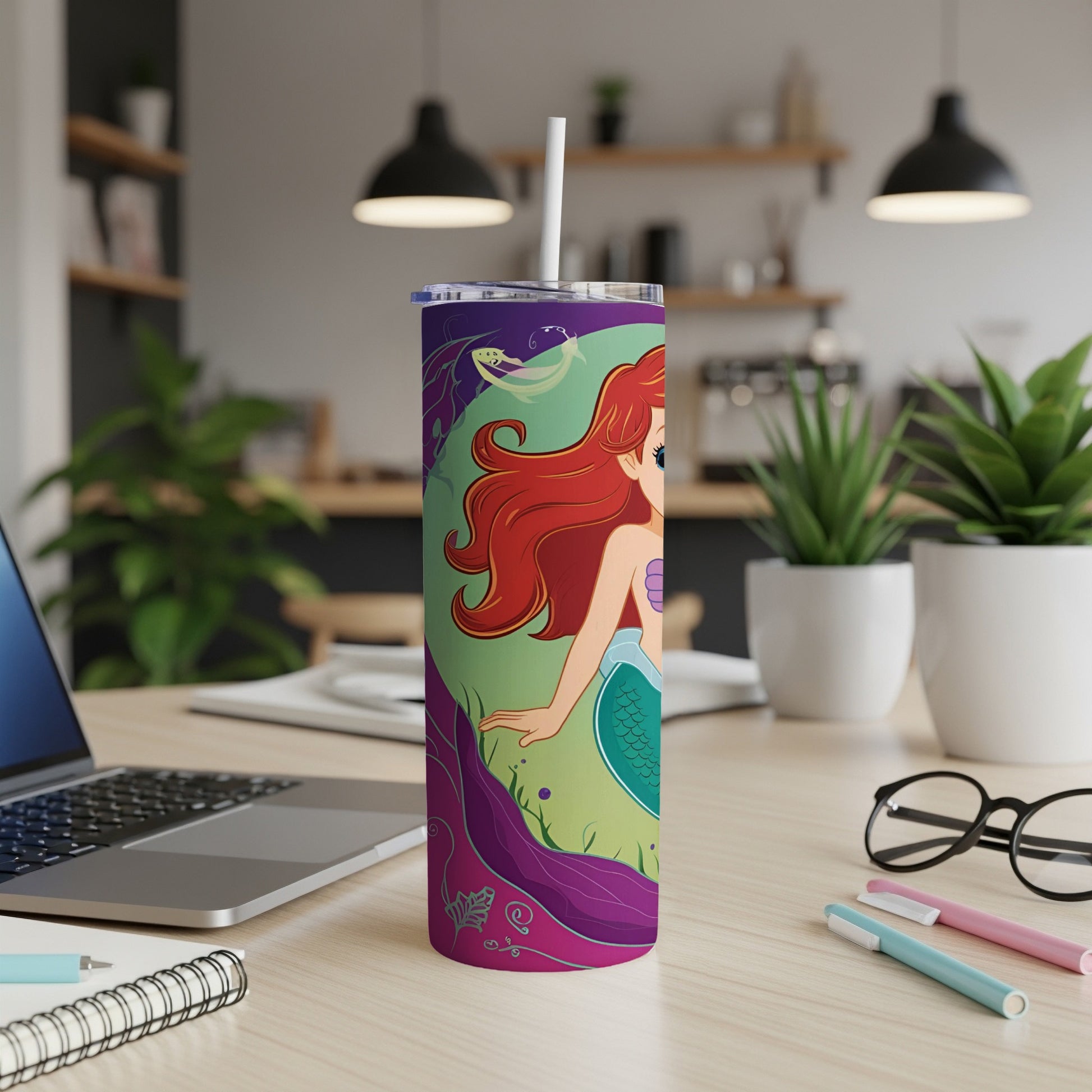 Ariel from The Little Mermaid on a purple tumbler with a straw.