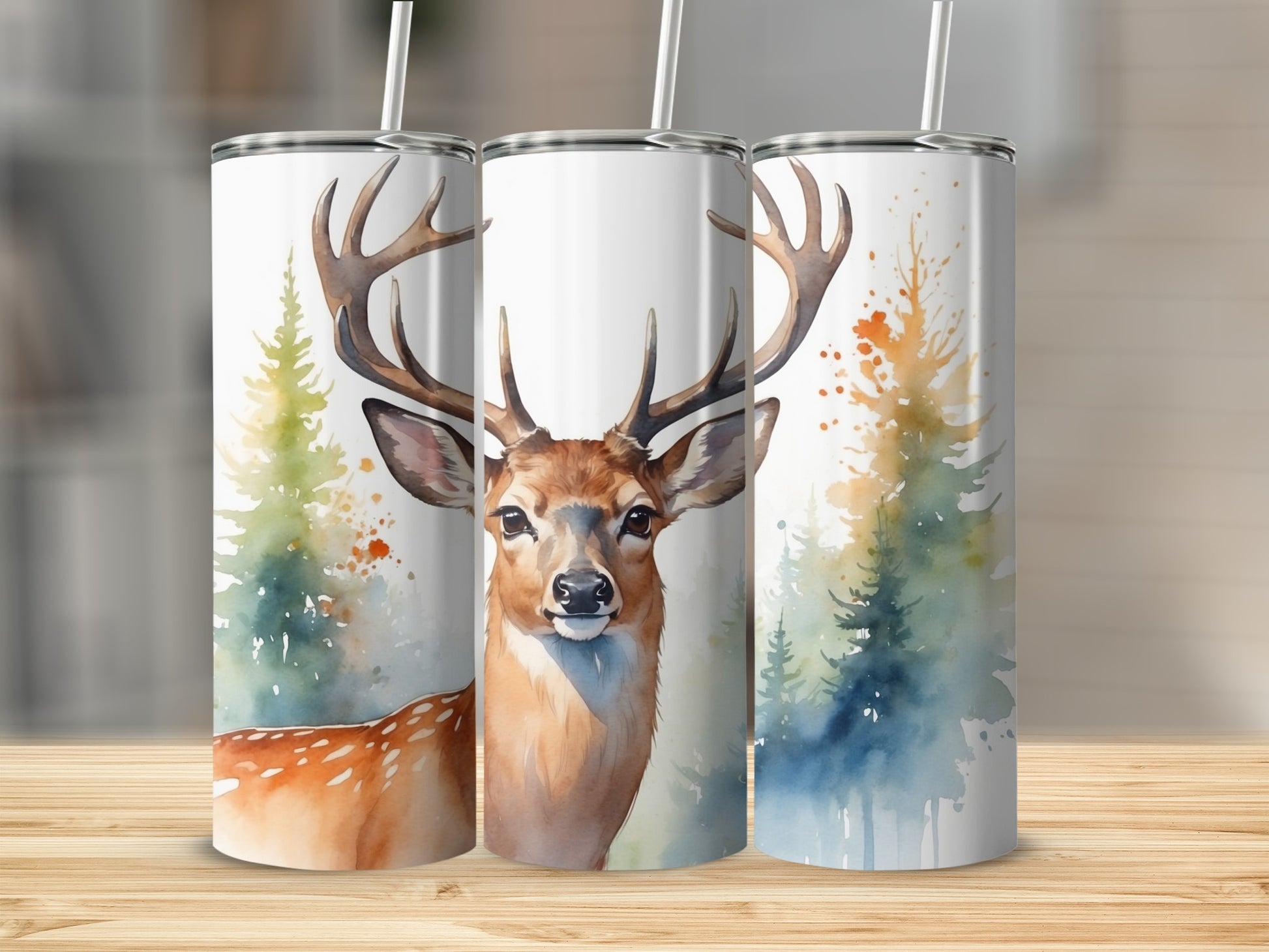 Watercolor deer and pine trees on a white insulated tumbler.