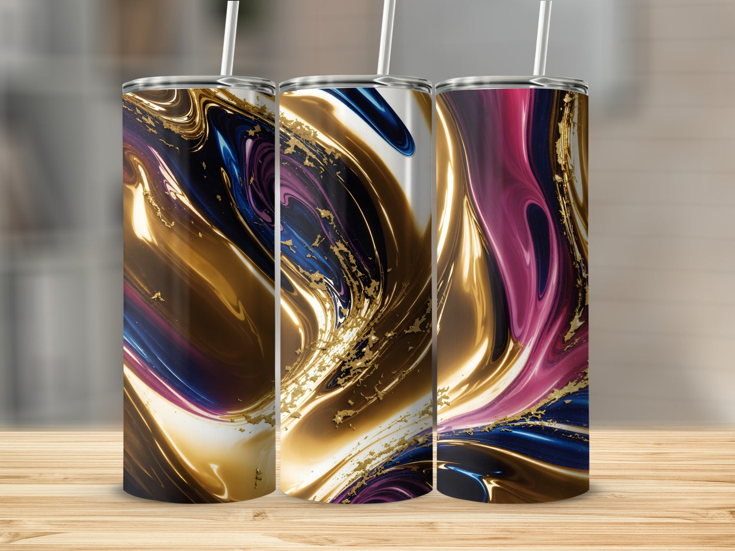 Three tumblers with swirling marbled abstract designs in gold, blue, and pink.