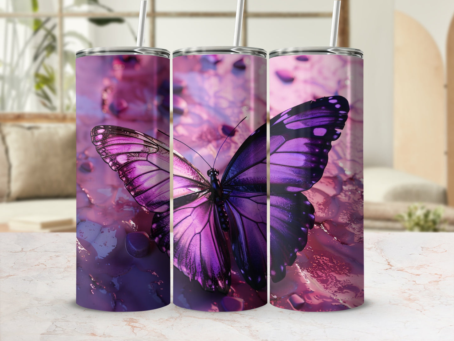 Purple butterfly tumbler with straws against a blurred background.