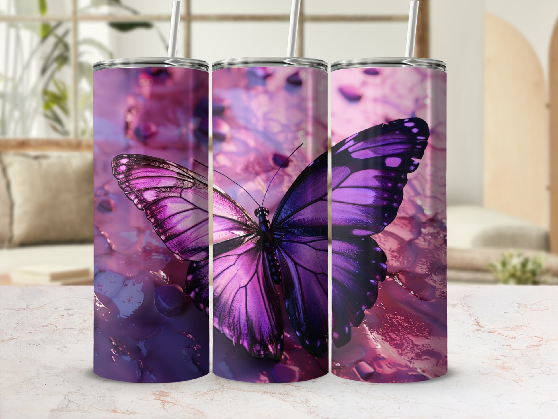 Purple butterfly tumbler with straws against a blurred background.