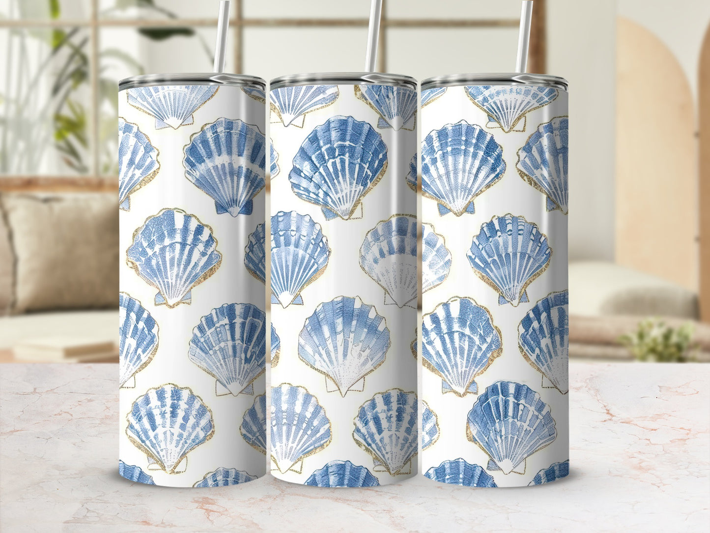Three tumblers with a blue and gold seashell pattern.