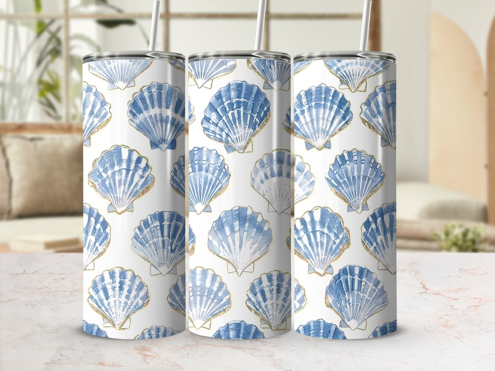 Three tumblers with a blue and gold seashell pattern.