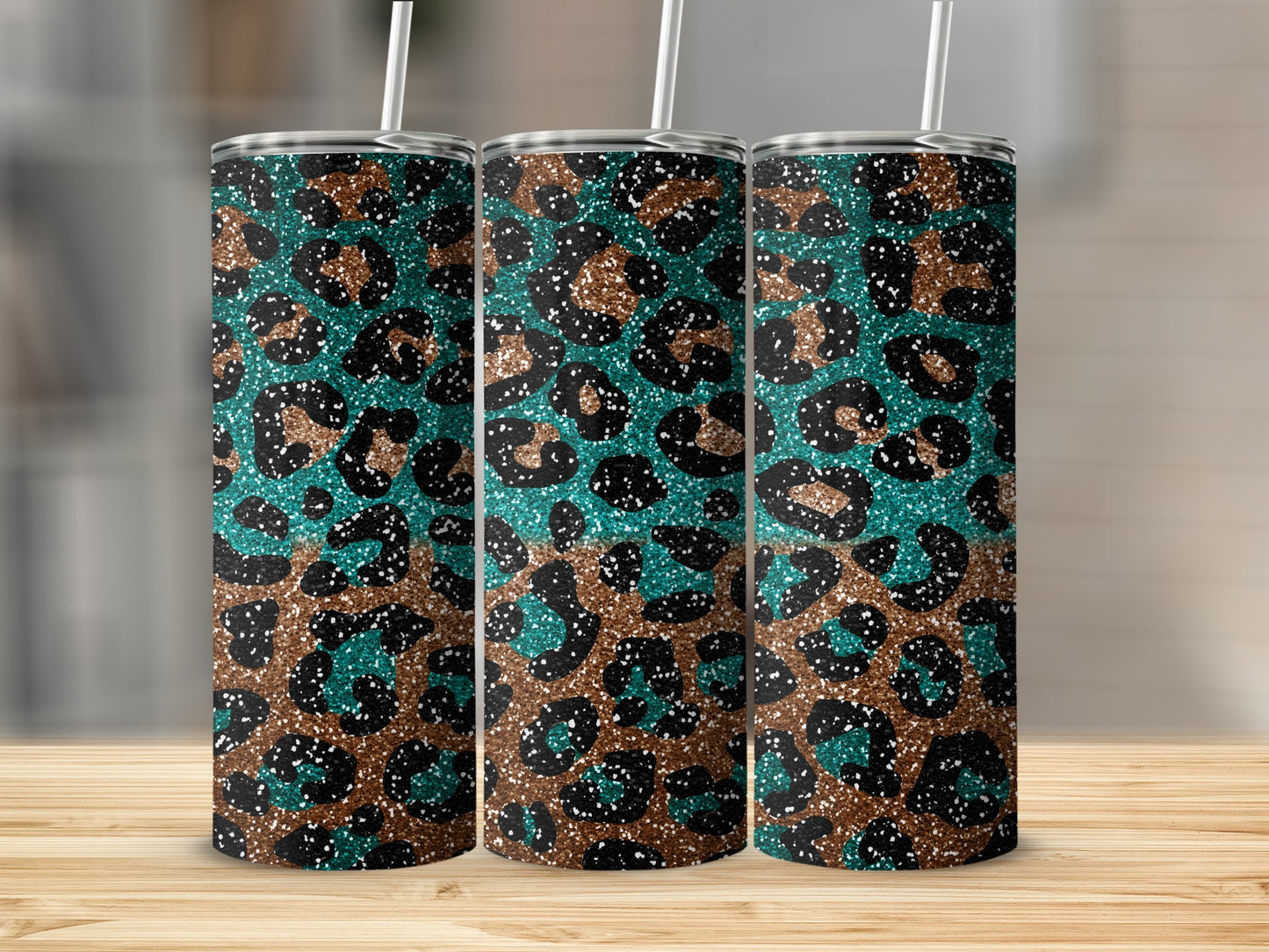 Three tall tumblers with a teal and brown leopard print pattern.