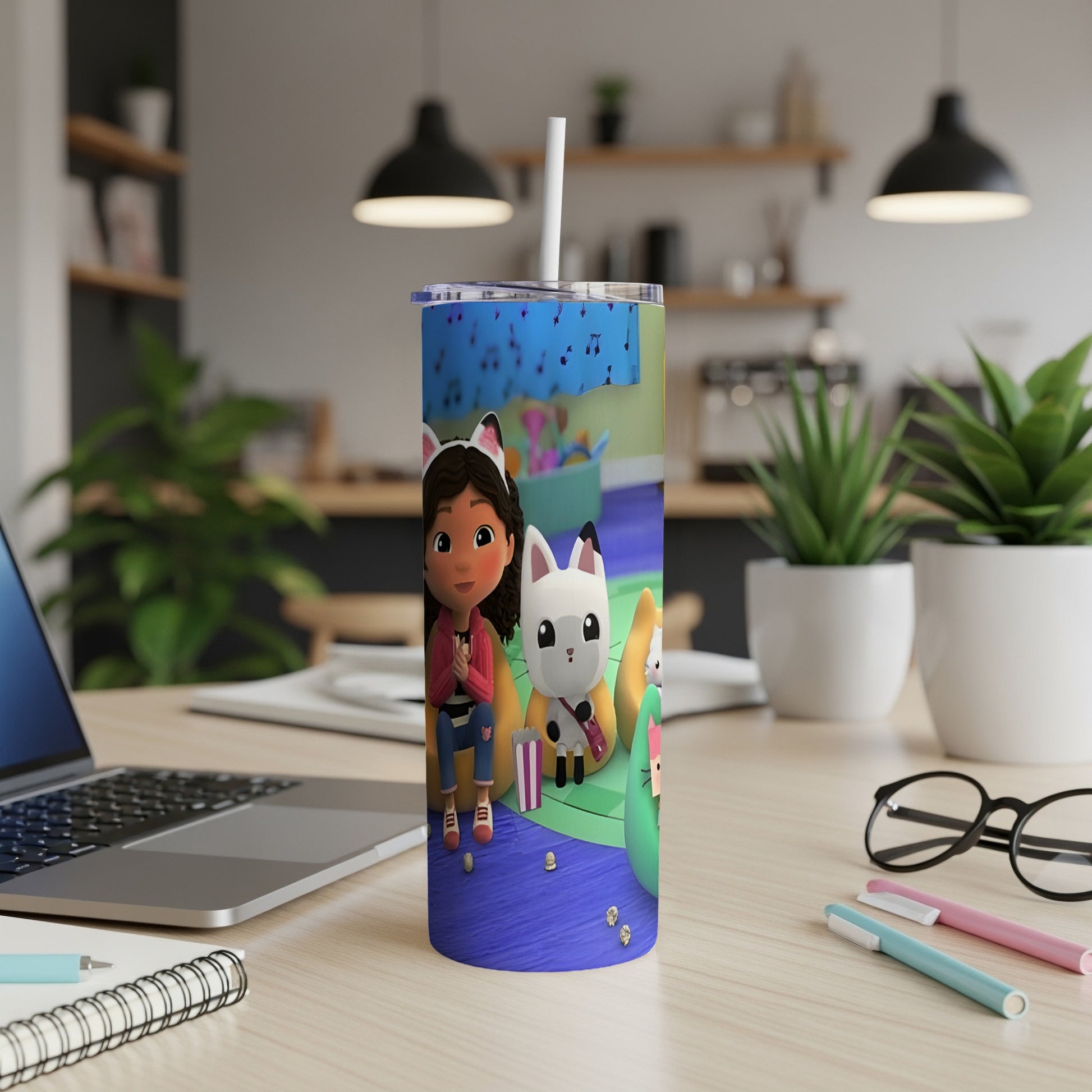 Gabby's Dollhouse tumbler with Gabby and Pandy Paws on a blue patterned background.