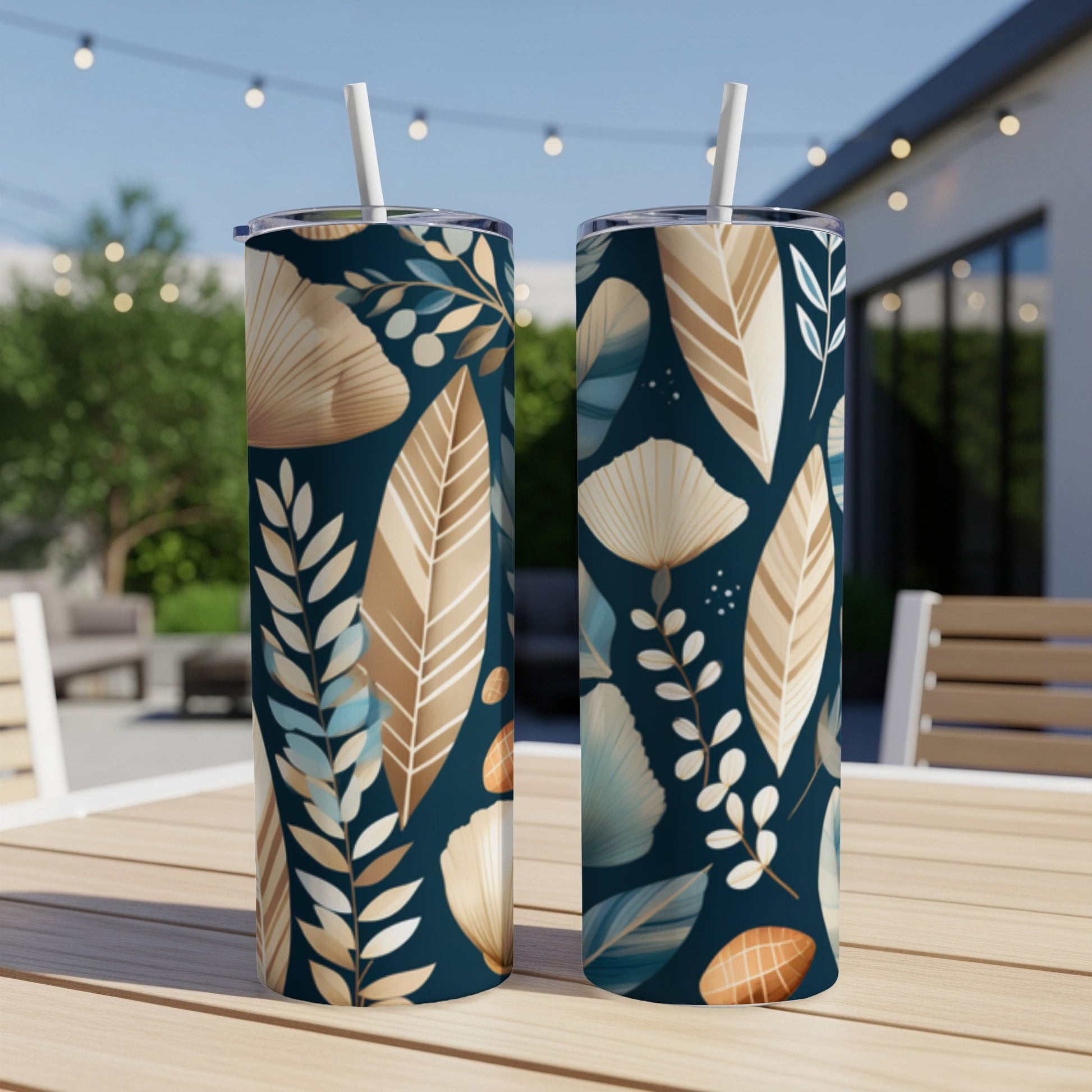 Two tumblers with a navy background and a botanical leaf pattern.